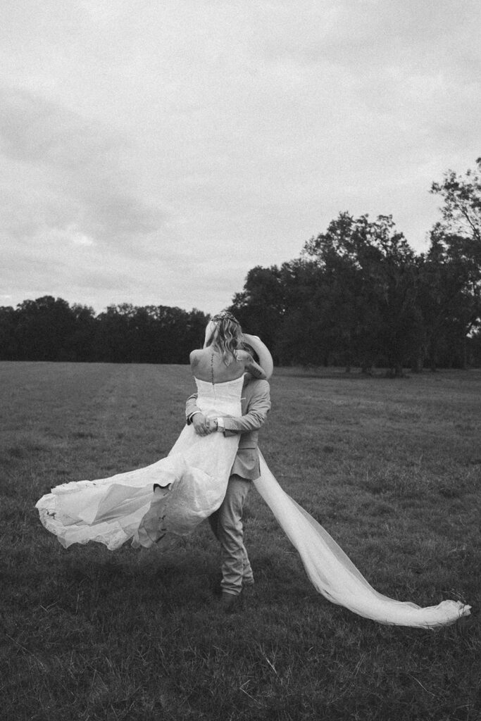 outdoor bride and groom portraits in a field