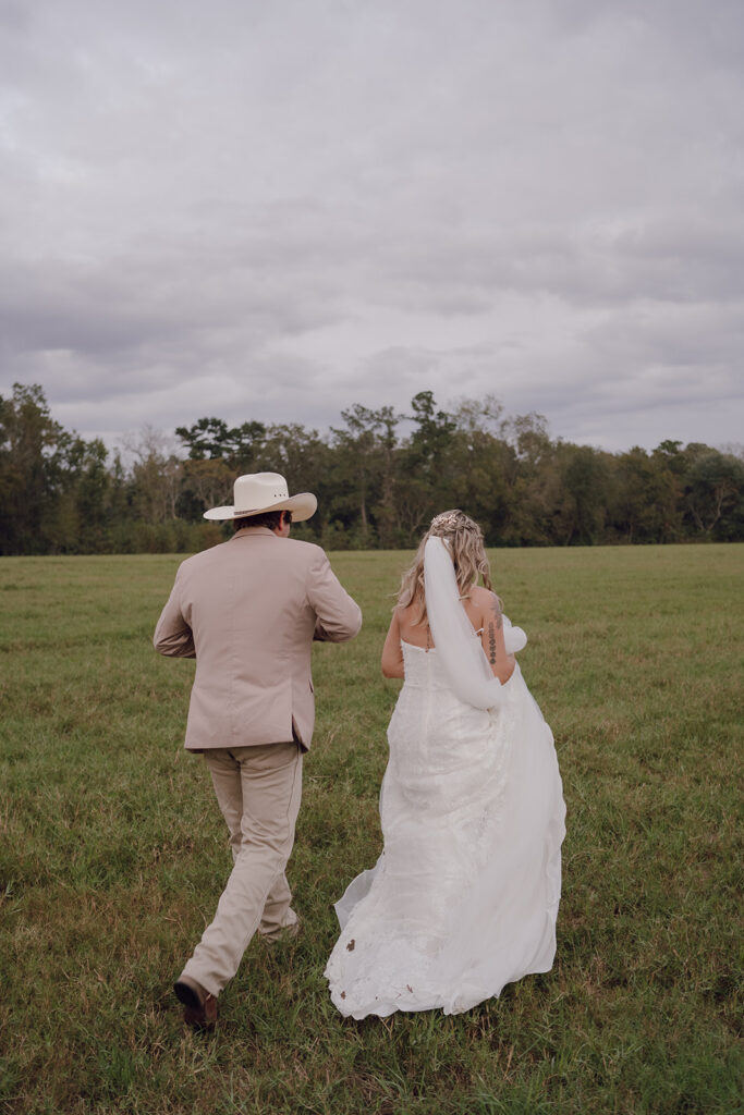 documentary style field wedding photos with the bride and groom