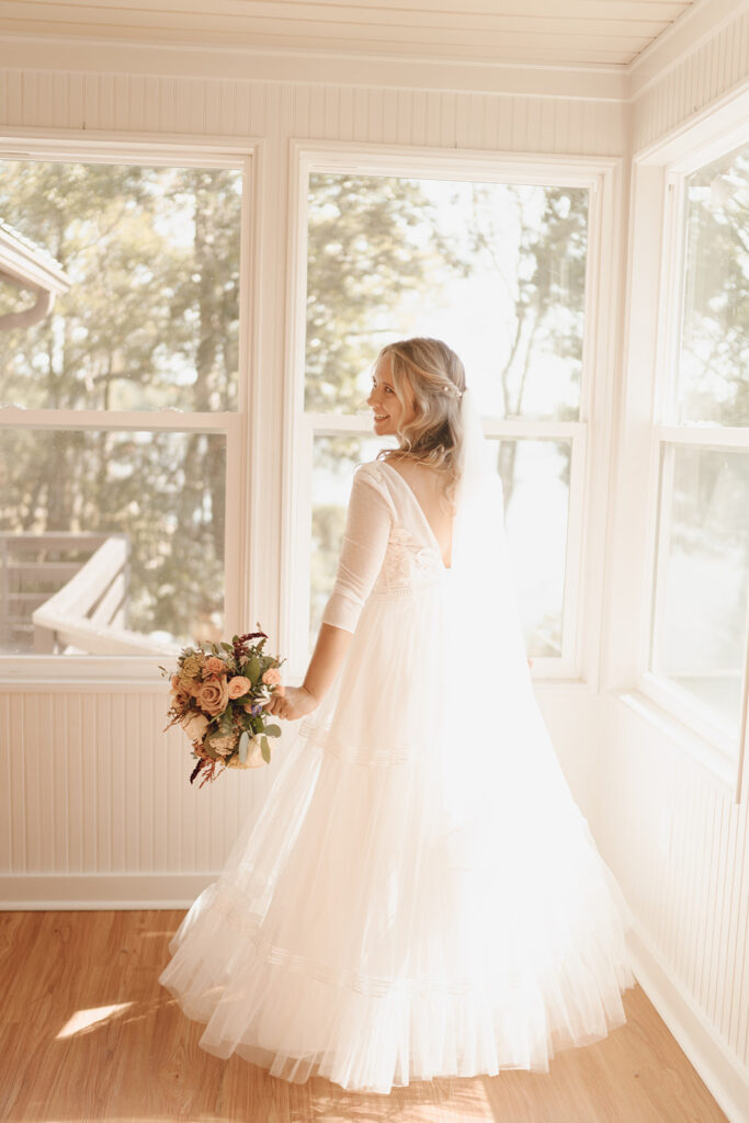 bride twirling in her dress getting ready wedding photos