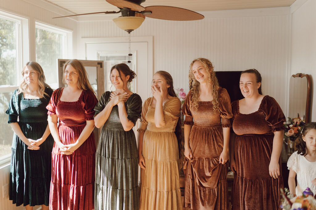 first look with bridesmaids reaction