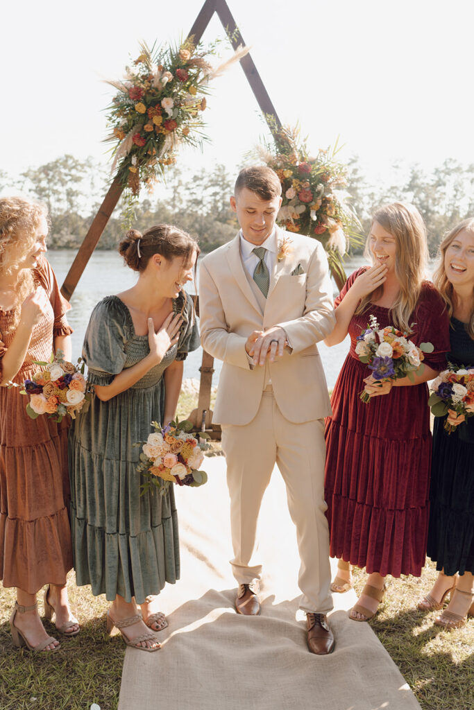bride and groom walking with bridal party for knoxville tn wedding photos