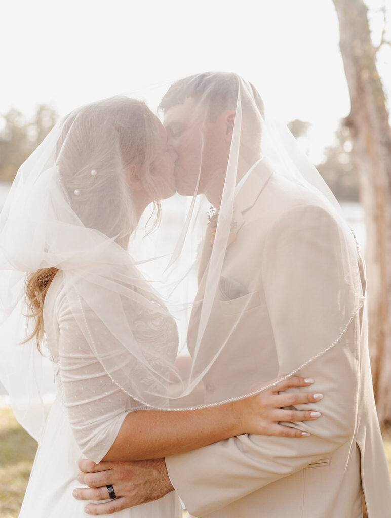 bride and groom photos outdoors lakeside wedding portraits