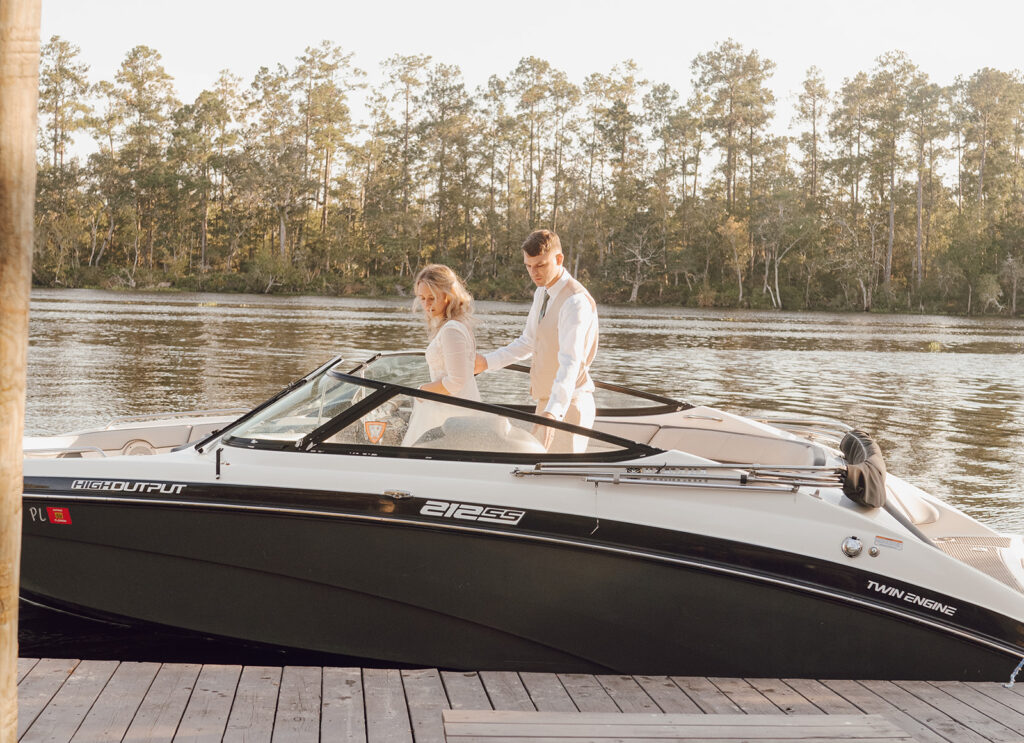 bride and groom on their getaway speedboat