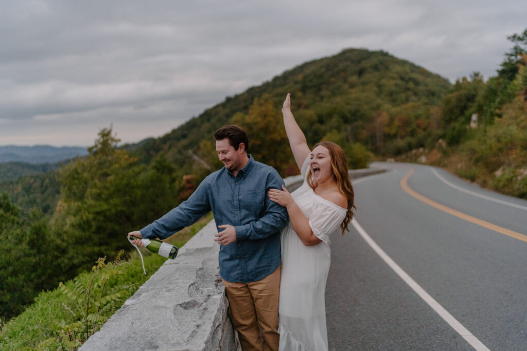 foothills parkway engagement photos popping champagne