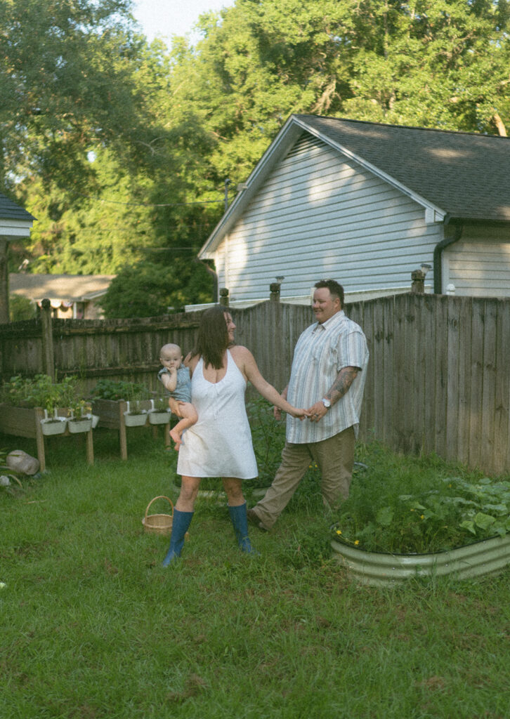 playful family photos in backyard with baby