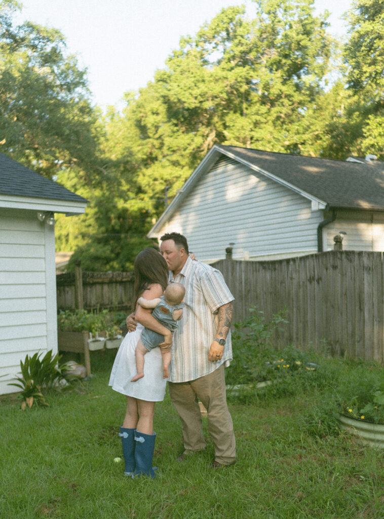 playful family photos in backyard with baby