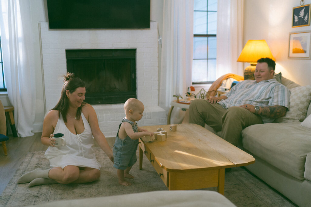 mom and dad playing blocks with baby