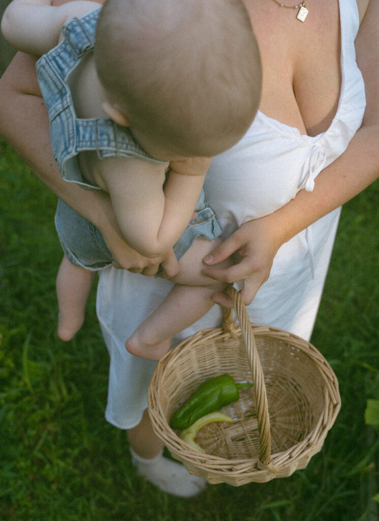 mom gardening with baby