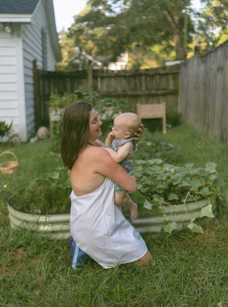 mom and baby playing in the backyard