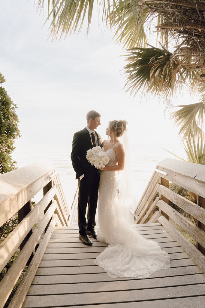dreamy beach wedding photos with the bride and groom