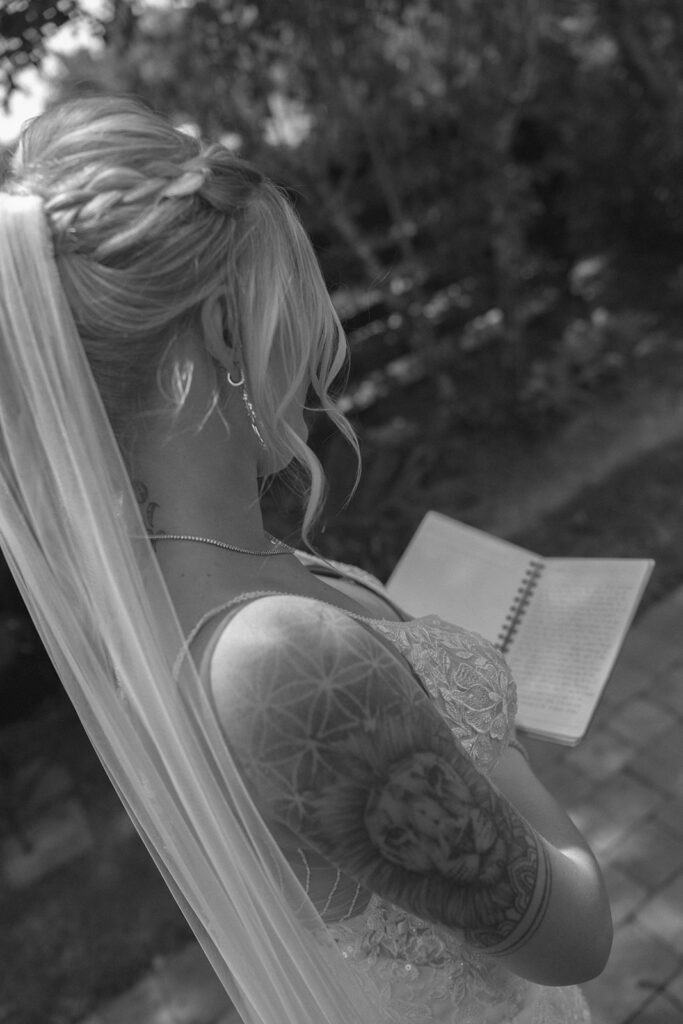 black and white film photos bride reading private vows