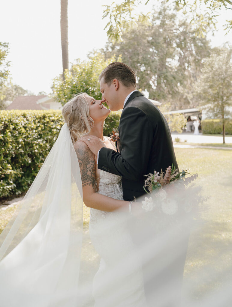 bride and groom brushing noses sunset portraits