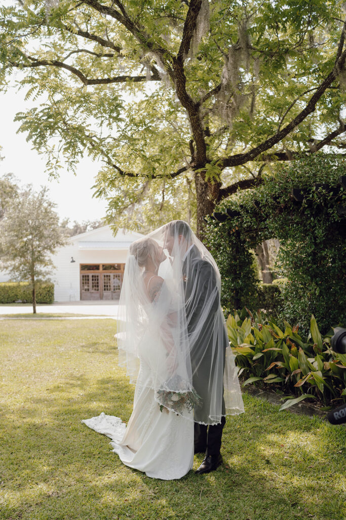 wedding veil photos with the bride and groom
