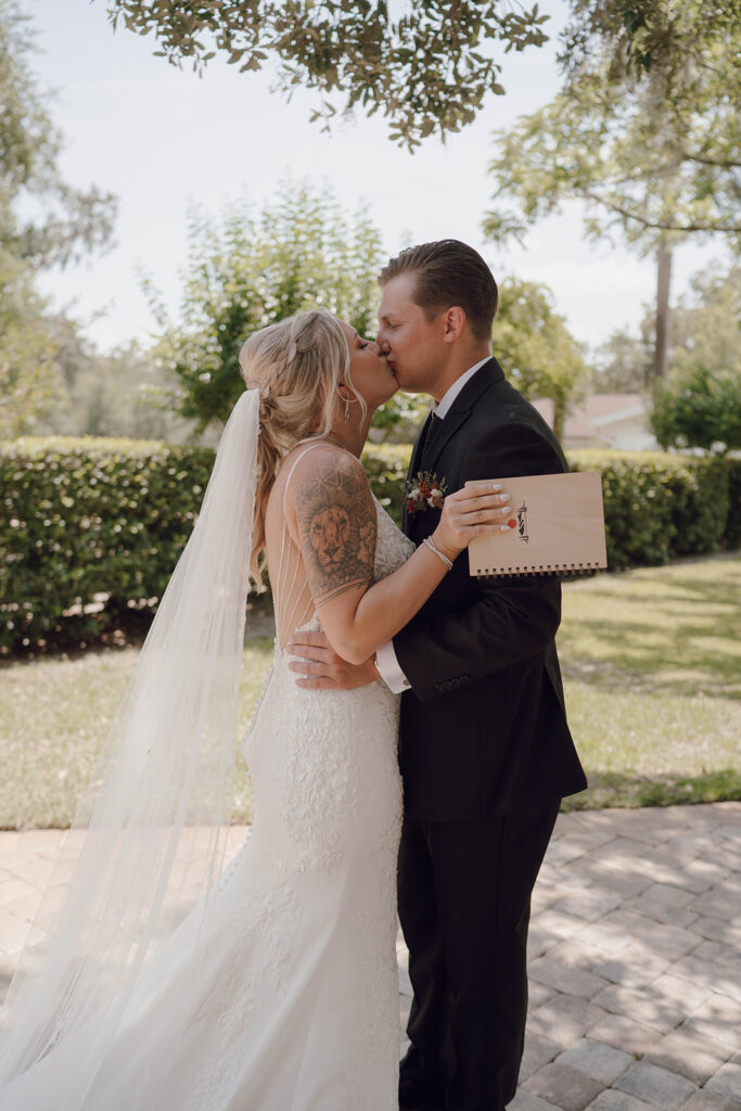 bride and groom reading private vows