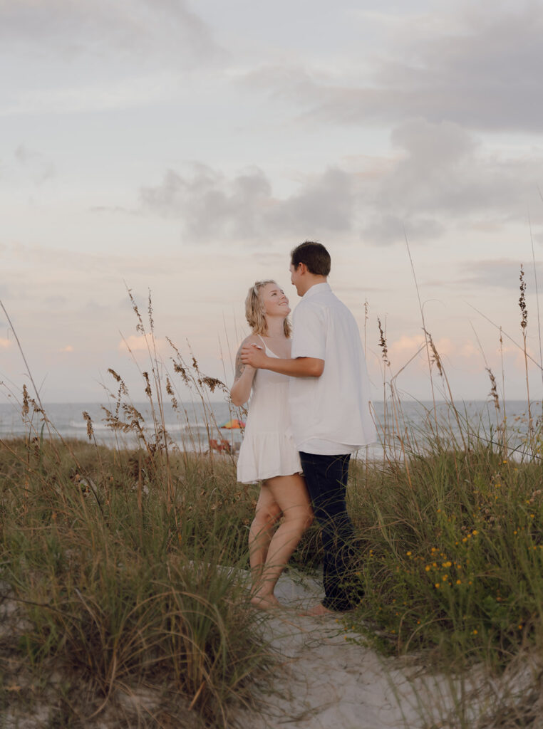 candid engagement photo poses on the beach