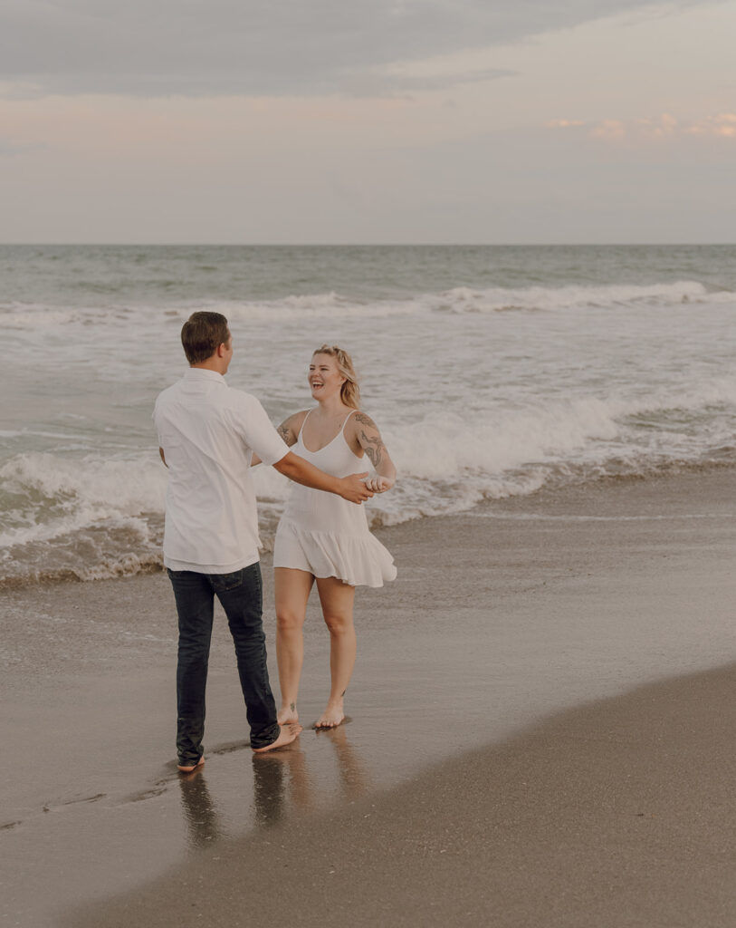 candid engagement photo poses on the beach