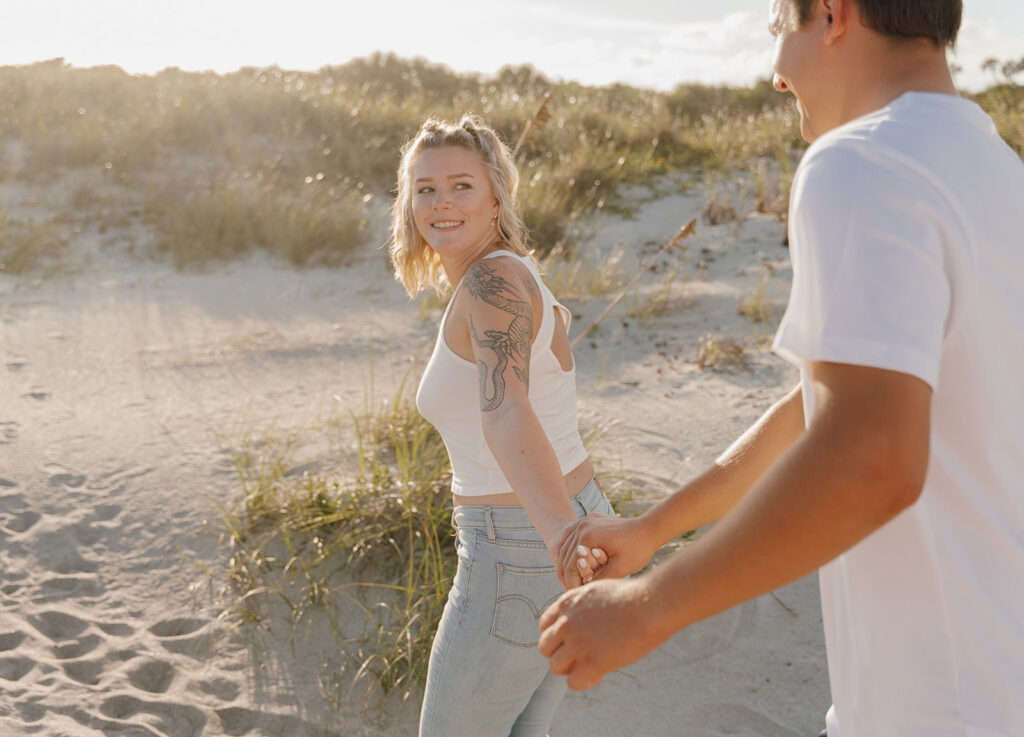 playful couples photos on the beach in florida