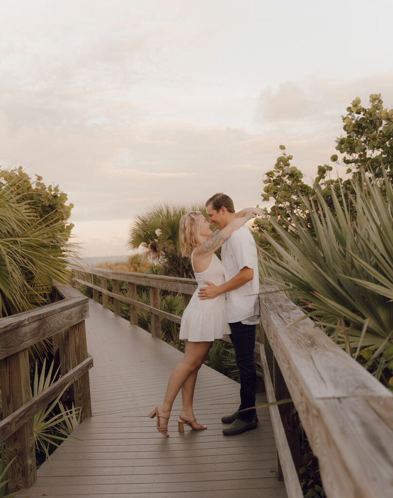 couple smiling at each other at the beach