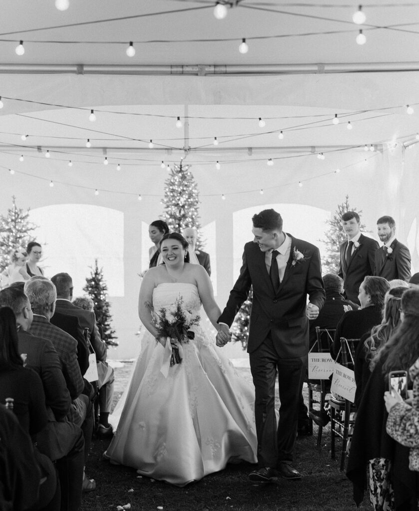 winter wedding theme ideas for an indoor ceremony that has twinkle lights and christmas trees