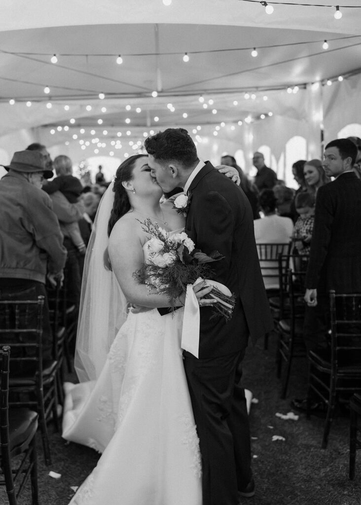 winter wedding theme ideas for an indoor ceremony that has twinkle lights and christmas trees