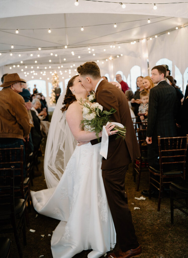 winter wedding theme ideas for an indoor ceremony that has twinkle lights and christmas trees