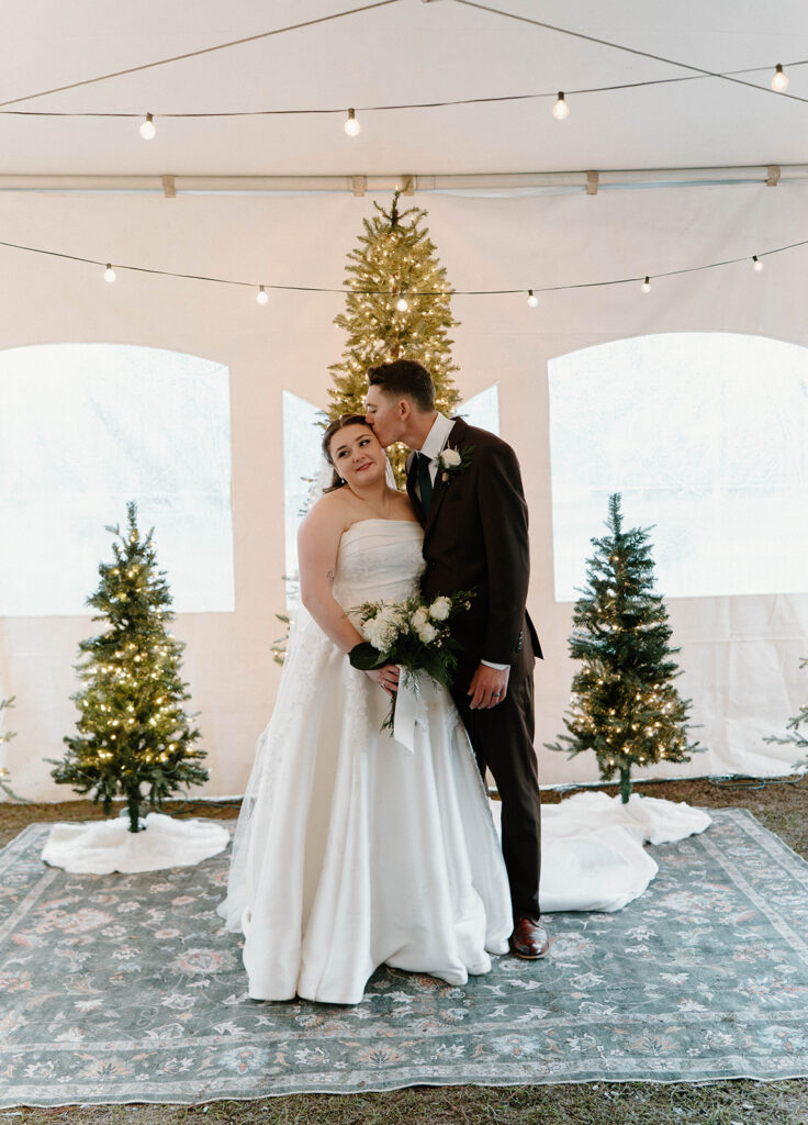 winter wedding theme ideas for an indoor ceremony that has twinkle lights and christmas trees