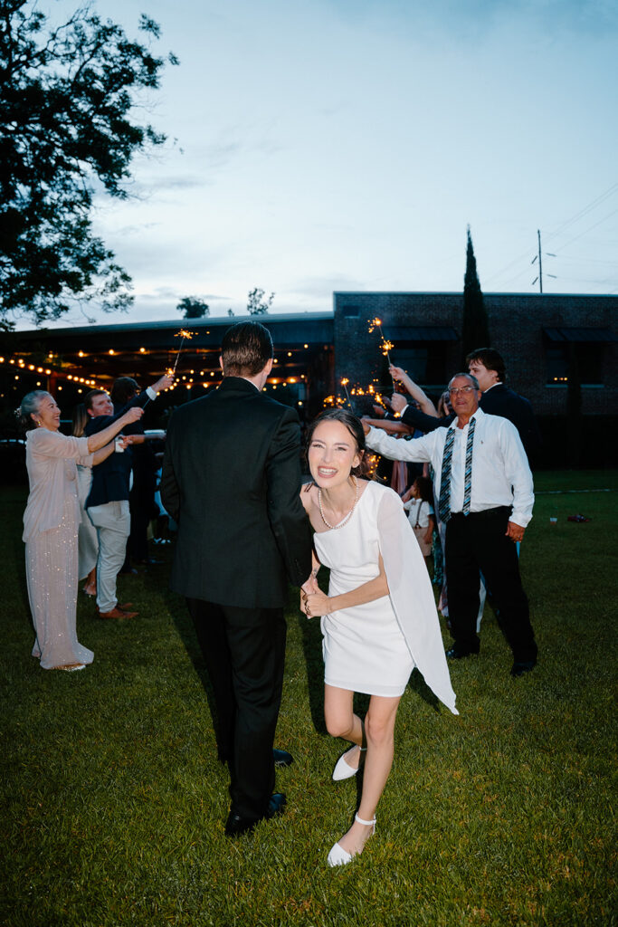 wedding exit photos with sparklers and cafe string lights