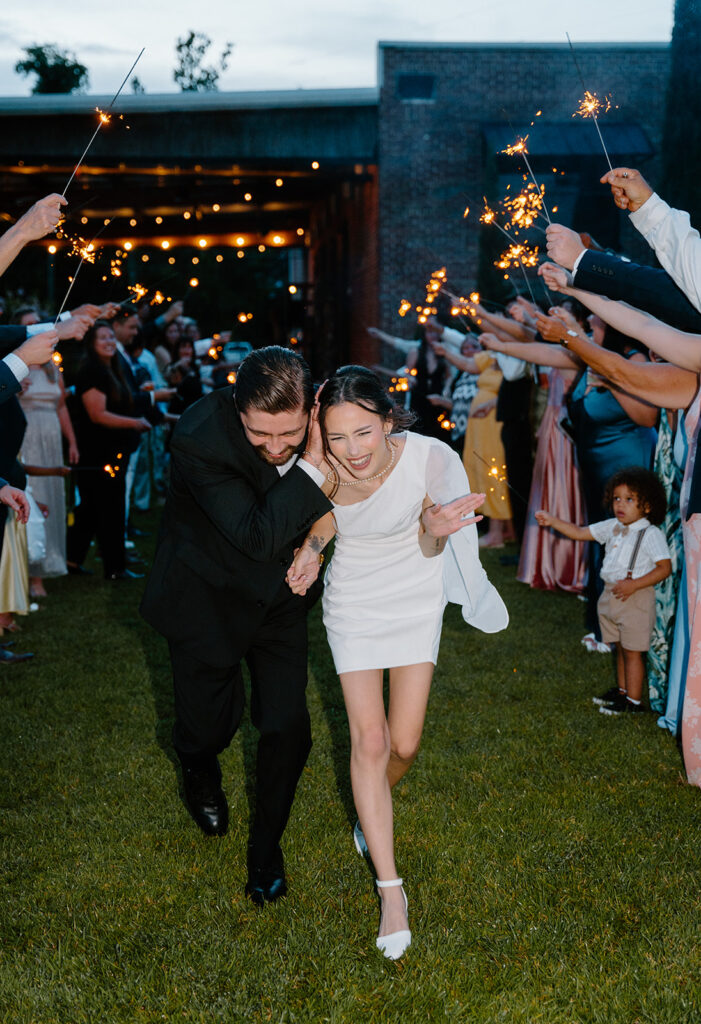 wedding exit photos with sparklers and cafe string lights