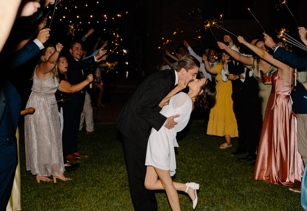 wedding exit photos with sparklers and cafe string lights