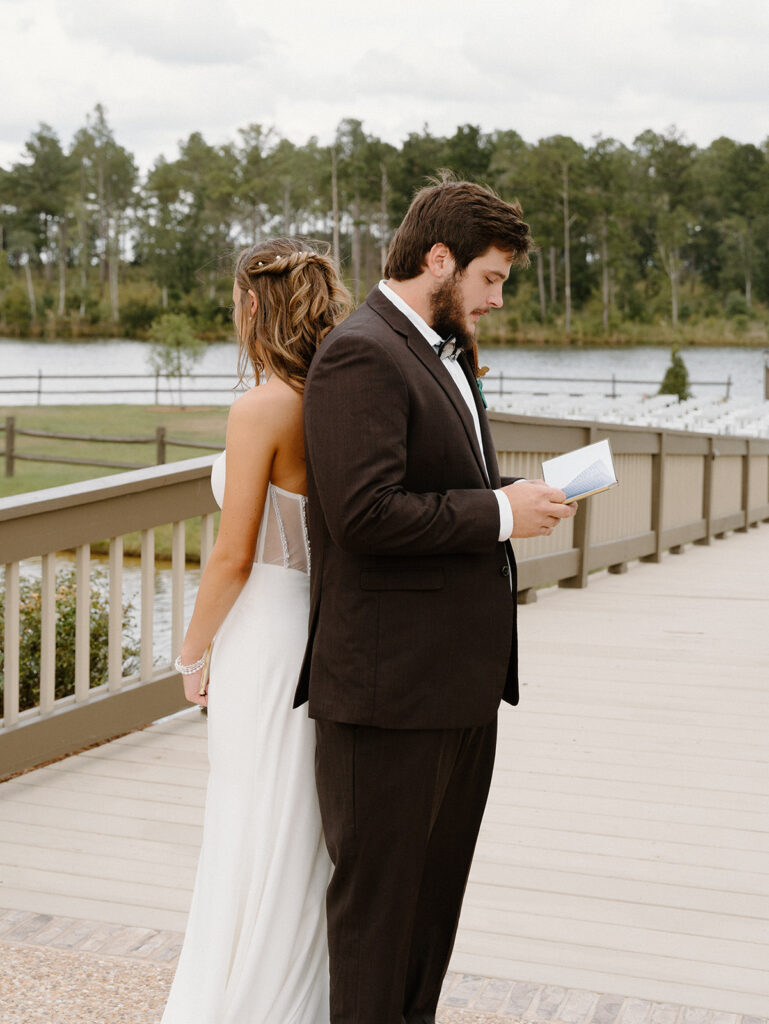 first touch with the bride and groom with a waterfront view at southwind plantation