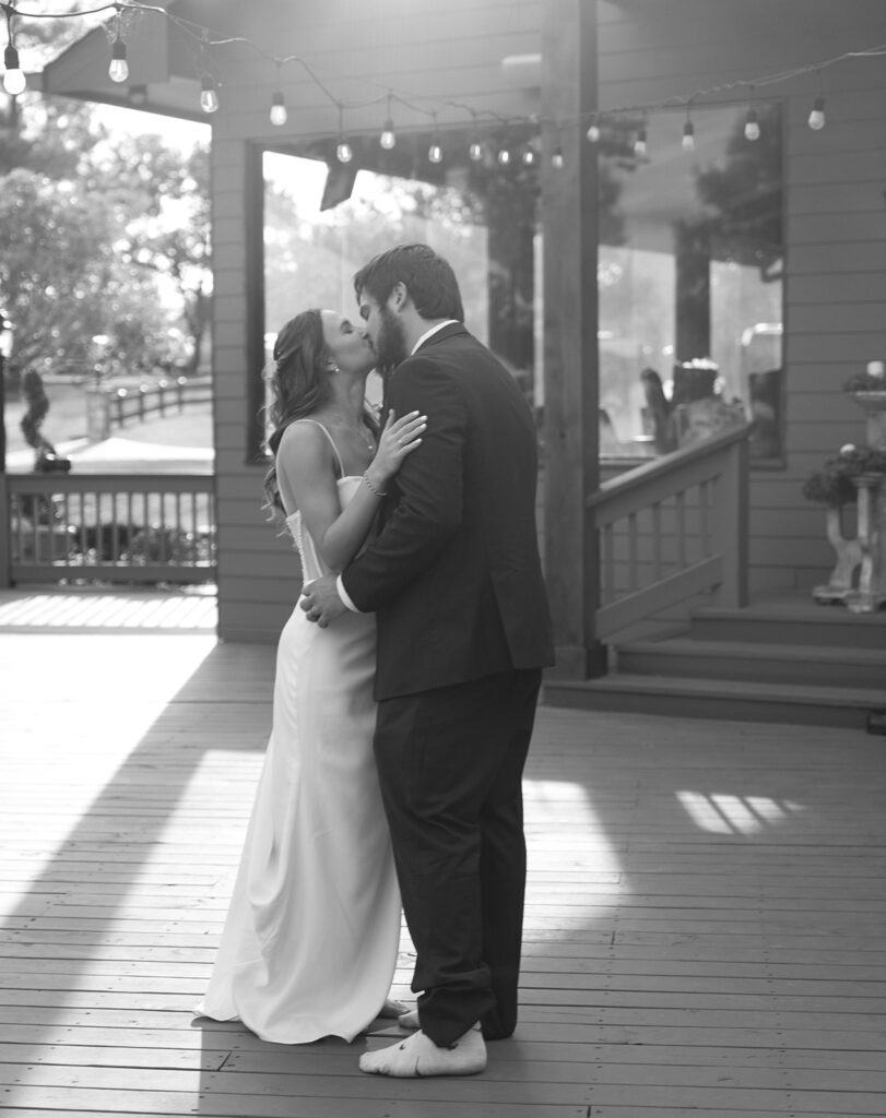 dreamy golden hour wedding reception photos documentary style with cafe lights at a georgia wedding venue
