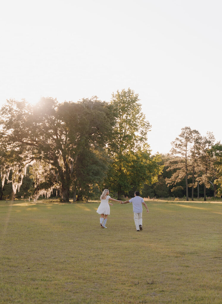 candid sunset couples photoshoot outdoors in a field