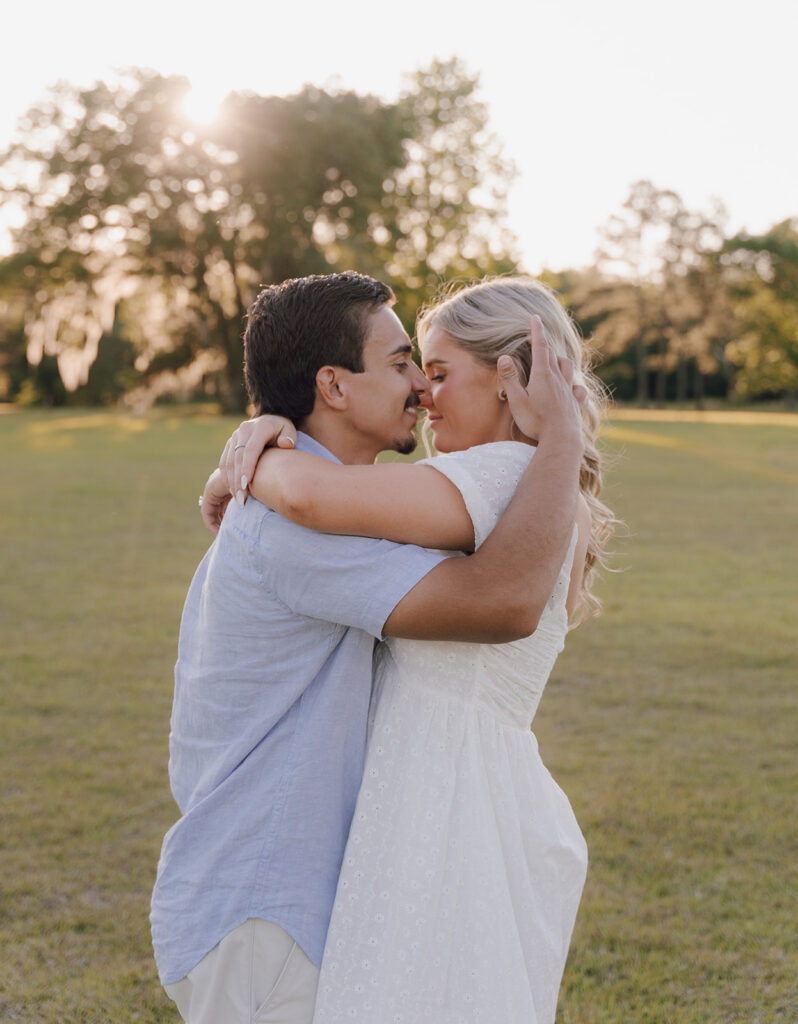 candid sunset couples photoshoot outdoors in a field