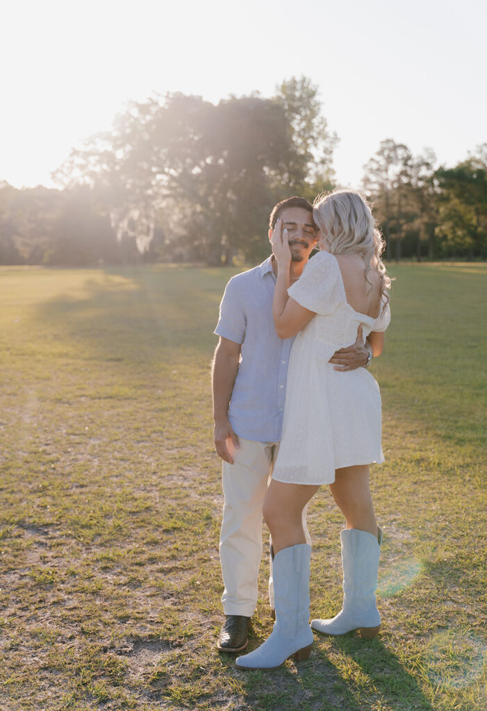candid sunset couples photoshoot outdoors in a field