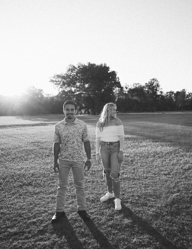 candid sunset couples photoshoot outdoors in a field