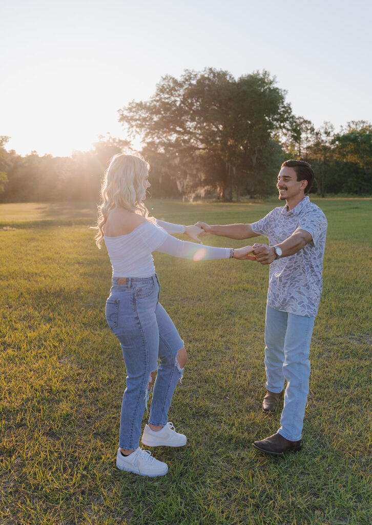 candid sunset couples photoshoot outdoors in a field