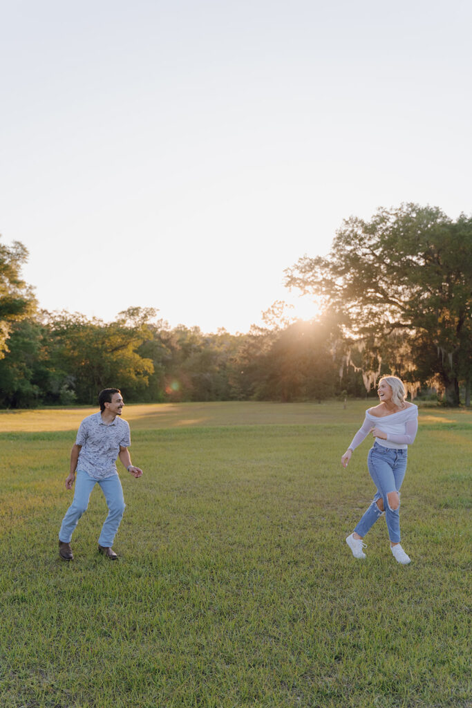 candid sunset couples photoshoot outdoors in a field