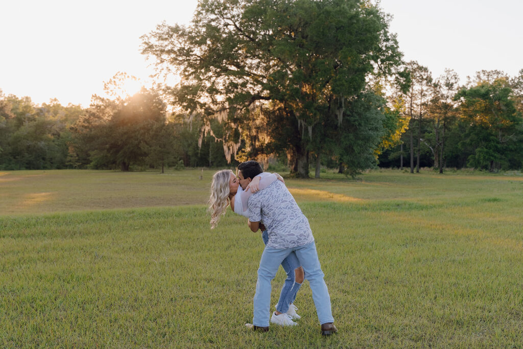 couple running around in a field in florida