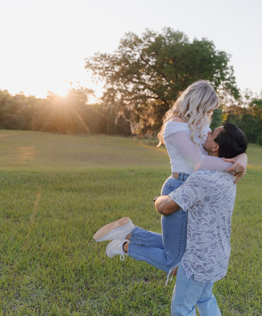 couple running around in a field in florida