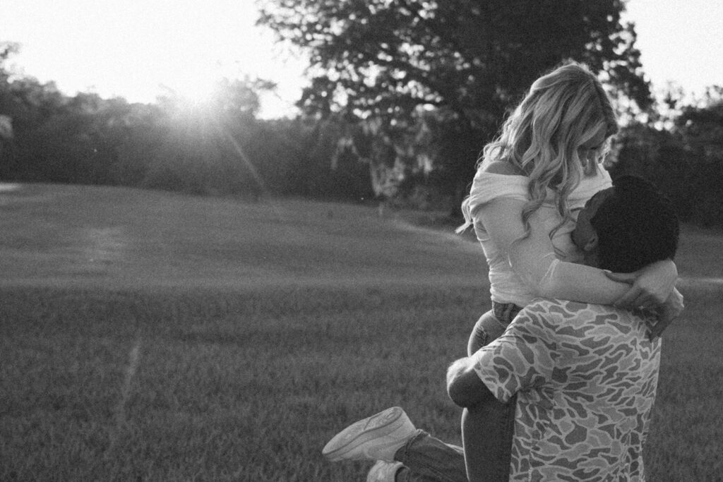 couple running around in a field in florida