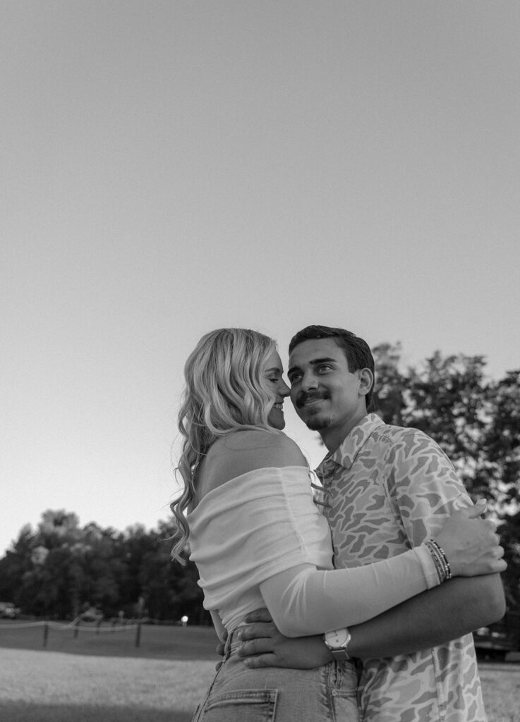 couple running around in a field in florida