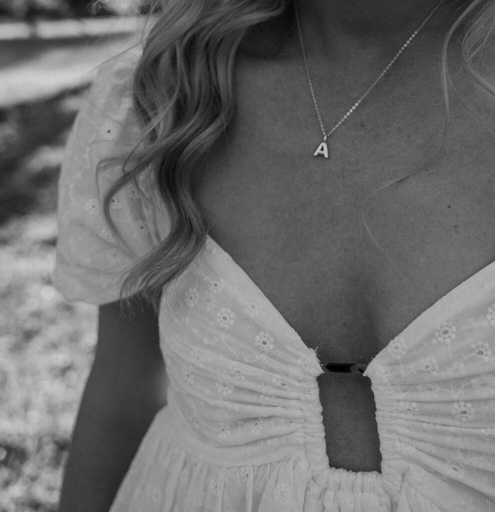 detail photo of initial necklace for engagement session