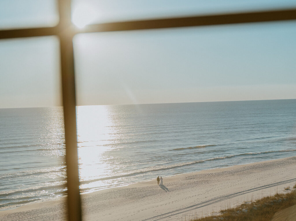 Documentary style sunset portraits of newlyweds on the beach