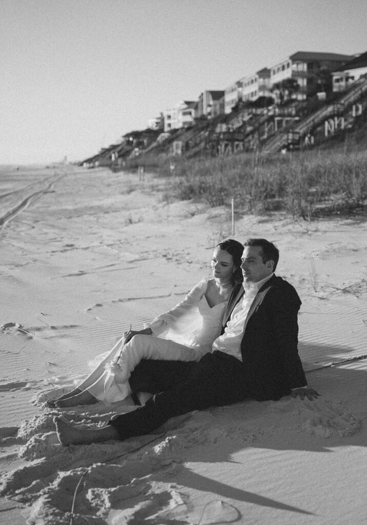 Documentary style sunset portraits of newlyweds on the beach