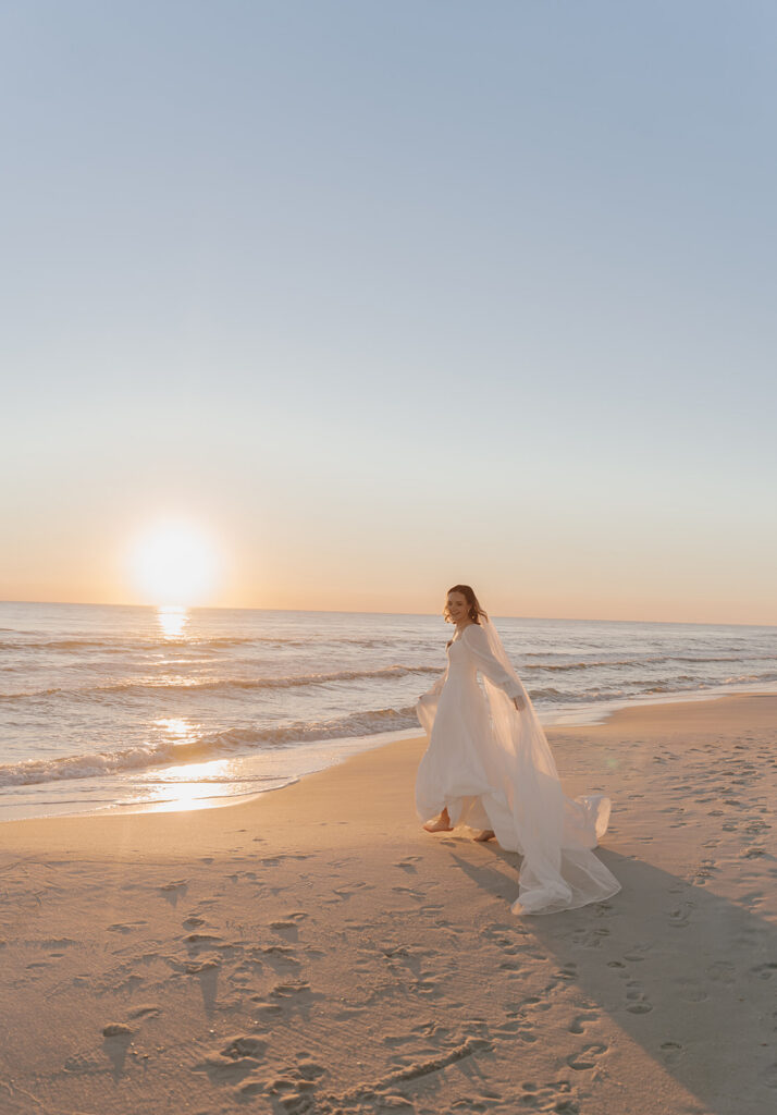 Documentary style sunset portraits of newlyweds on the beach
