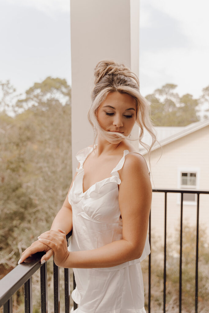 A bride before the wedding ceremony with her hair and makeup done.