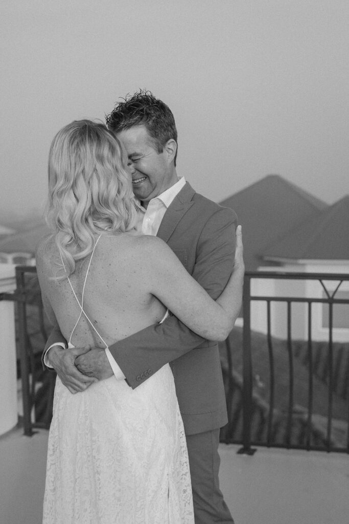 A bride and groom hugging during their first look at their wedding in the Bahamas.