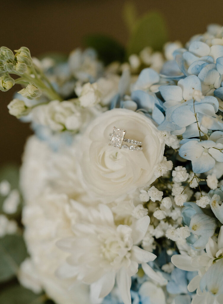 Wedding rings and wedding florals.