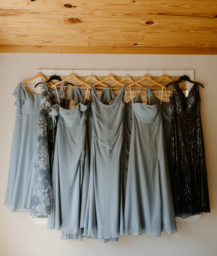 Bridal party's dresses hanging up.