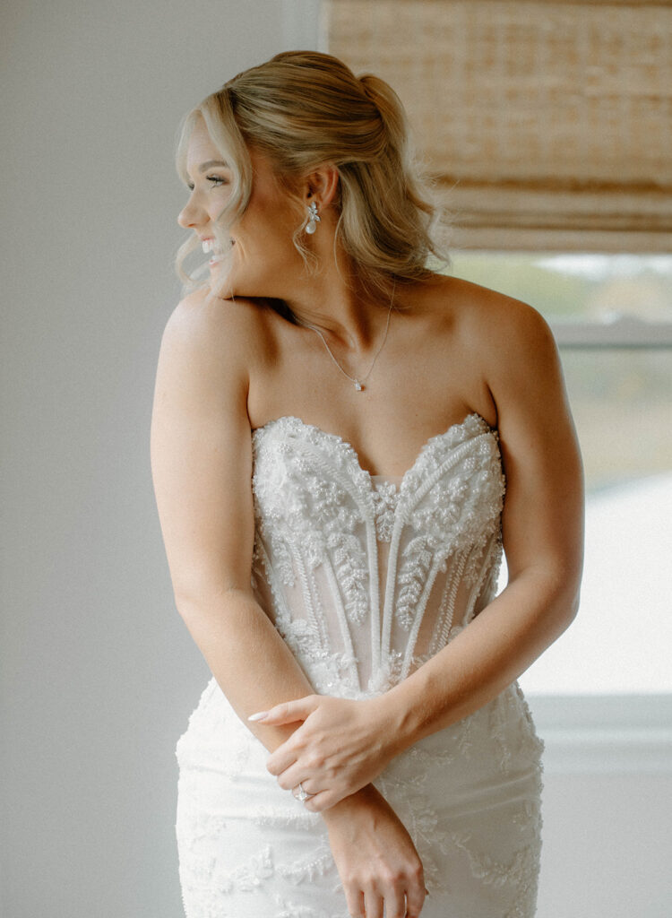 Bride smiling and looking to the side.